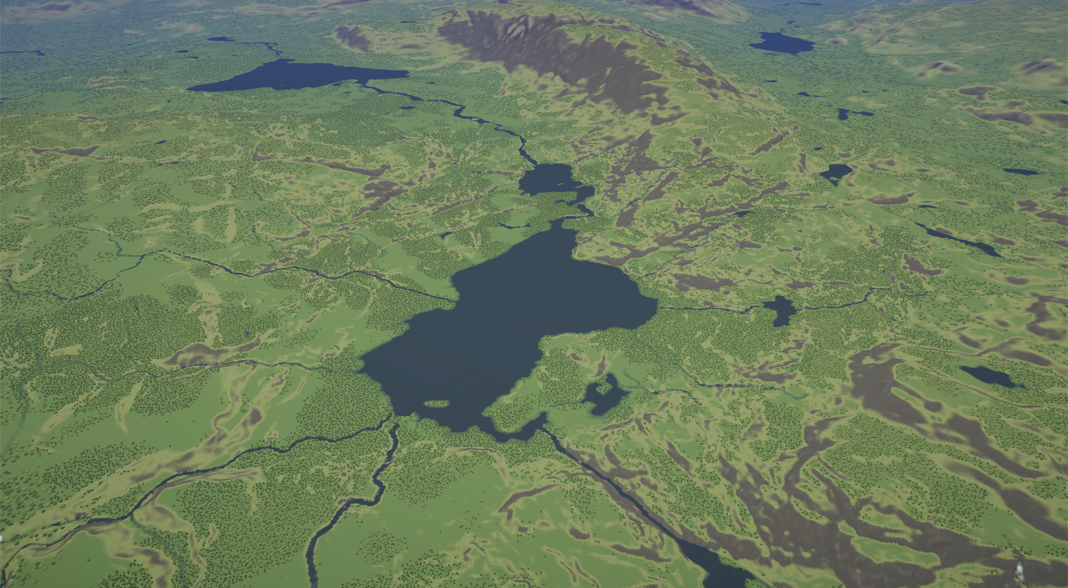 An aerial Terraform view of connected lakes and rivers beneath a mountain ridge